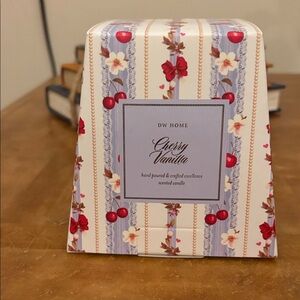DW Home Cherry Vanilla Candle with Red and Cream Design
